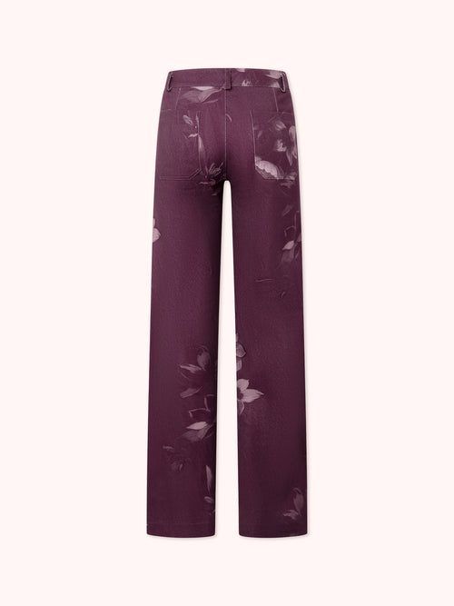 PANTALÓN FLARE CON ESTAMPADO FLORAL MORADO