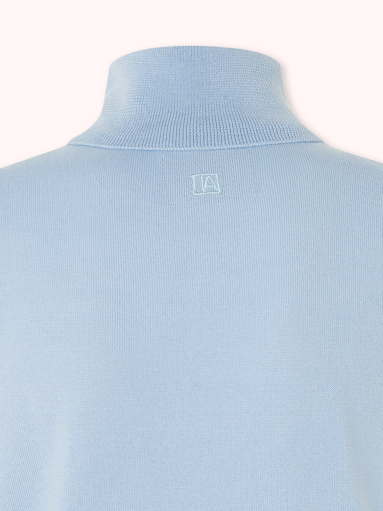 SUÉTER CUELLO CISNE SIN MANGAS AZUL CELESTE