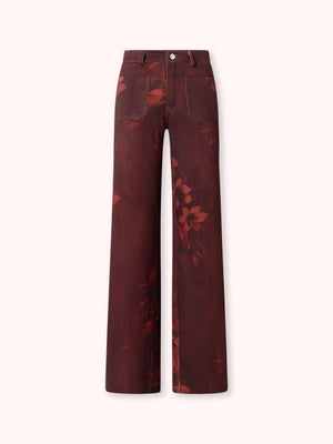 PANTALÓN FLARE CON ESTAMPADO FLORAL BURDEOS